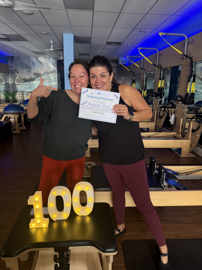 A photo of me receiving my 100 class participation certificate at Club Pilates, also one of the participating premium partners at Active&Fit Direct, which saves you money on gym memberships with big benefits without the obligation.