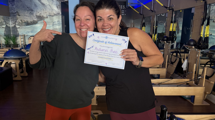 A photo of me receiving my 100 class participation certificate at Club Pilates, also one of the participating premium partners at Active&Fit Direct, which saves you money on gym memberships with big benefits without the obligation.